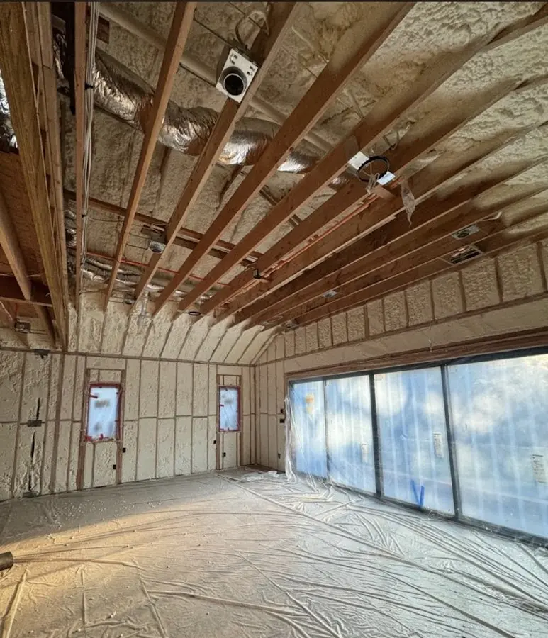Interior walls and ceiling insulated with spray foam during new construction in Newburgh